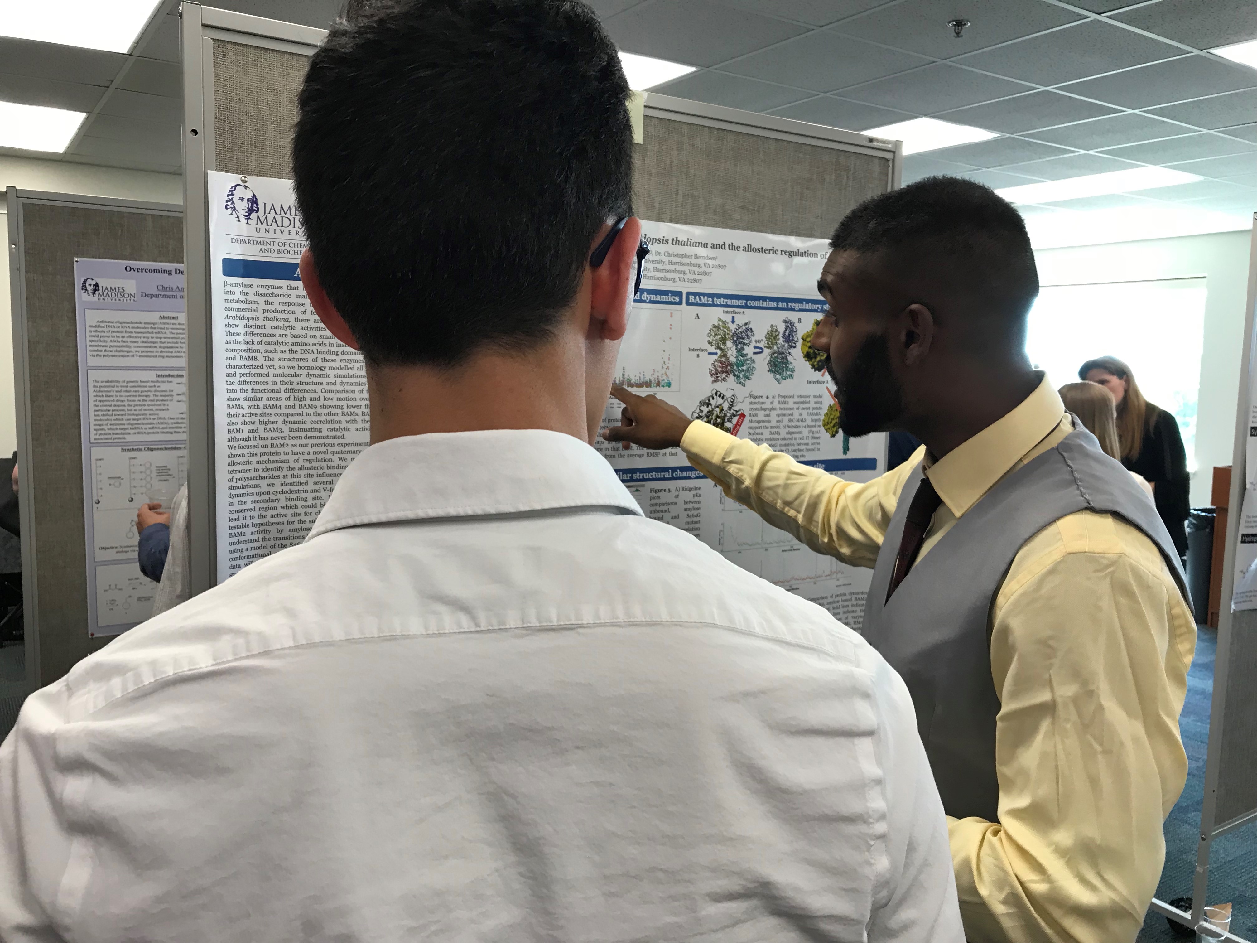 Nithesh showing his poster at the end of summer symposium